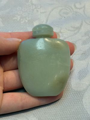 A Chinese celadon jade snuff bottle, a plaque and a ritual stick, Han and later — photo 16