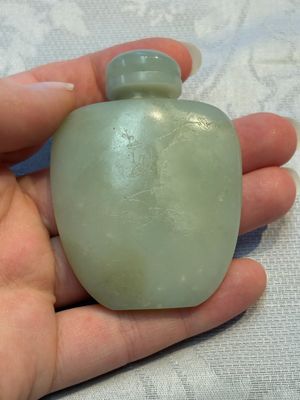 A Chinese celadon jade snuff bottle, a plaque and a ritual stick, Han and later — photo 18