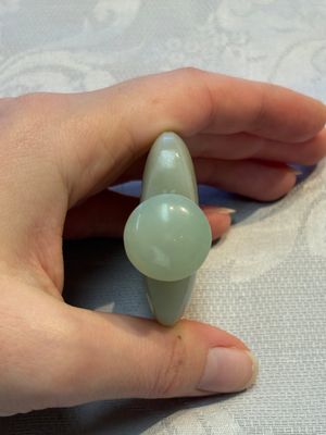 A Chinese celadon jade snuff bottle, a plaque and a ritual stick, Han and later — photo 20