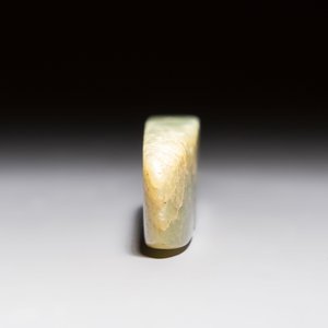 A Chinese celadon jade snuff bottle, a plaque and a ritual stick, Han and later — photo 11