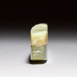 A Chinese celadon jade snuff bottle, a plaque and a ritual stick, Han and later — photo 10