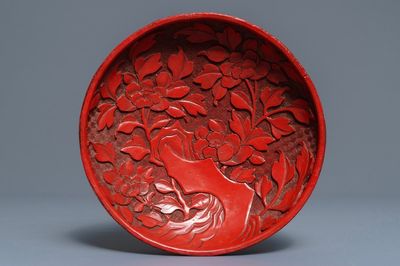 A Chinese cinnabar lacquer dish with floral design, 18/19th C.
