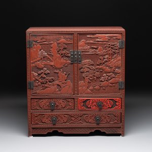A Chinese cinnabar lacquer 'mountainous landscape' cabinet, 19th C. — photo 3