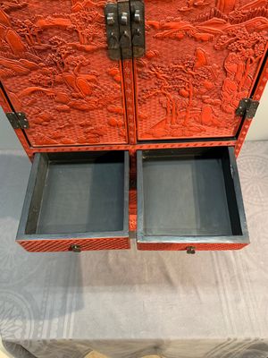A Chinese cinnabar lacquer 'mountainous landscape' cabinet on a stand, 19th C. — photo 13