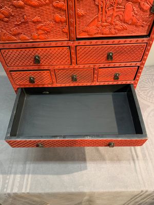 A Chinese cinnabar lacquer 'mountainous landscape' cabinet on a stand, 19th C. — photo 15