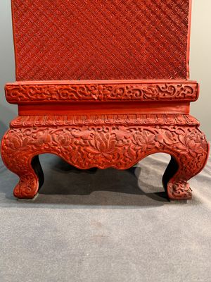 A Chinese cinnabar lacquer 'mountainous landscape' cabinet on a stand, 19th C. — photo 18