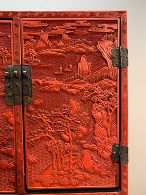A Chinese cinnabar lacquer 'mountainous landscape' cabinet on a stand, 19th C. — photo 3