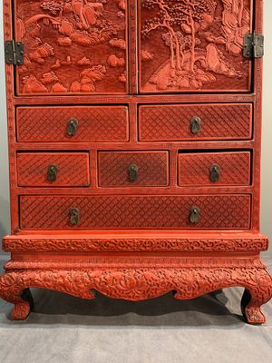 A Chinese cinnabar lacquer 'mountainous landscape' cabinet on a stand, 19th C. — photo 4