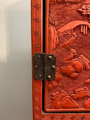 A Chinese cinnabar lacquer 'mountainous landscape' cabinet on a stand, 19th C. — photo 6