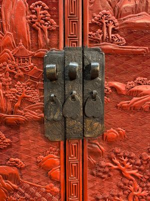 A Chinese cinnabar lacquer 'mountainous landscape' cabinet on a stand, 19th C. — photo 7