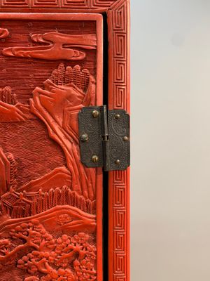 A Chinese cinnabar lacquer 'mountainous landscape' cabinet on a stand, 19th C. — photo 9