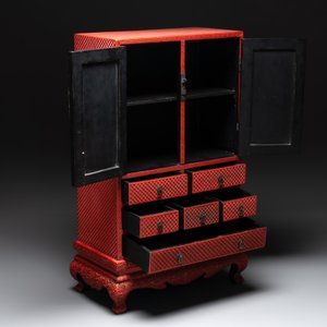 A Chinese cinnabar lacquer 'mountainous landscape' cabinet on a stand, 19th C. — photo 2