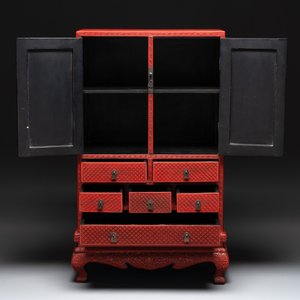 A Chinese cinnabar lacquer 'mountainous landscape' cabinet on a stand, 19th C. — photo 5