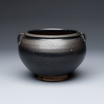 A Chinese Cizhou black-glazed jar with handles, Jin/Yuan