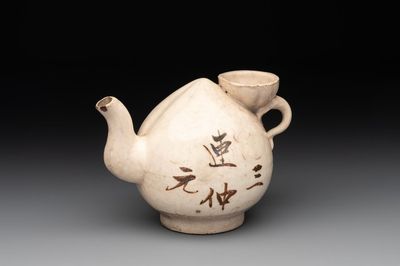 A Chinese Cizhou peach-shaped 'Lian Zhong San Yuan 連仲三元' ewer, Yuan/Ming