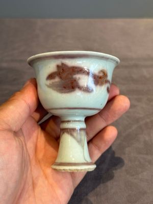 A Chinese copper-red and white 'chilong' stem cup, Ming — photo 1