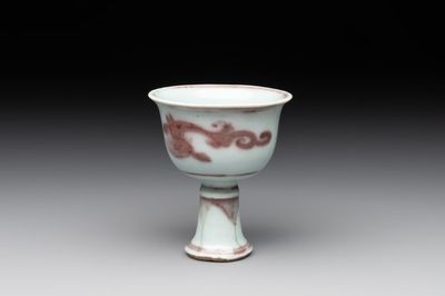 A Chinese copper-red and white 'chilong' stem cup, Ming
