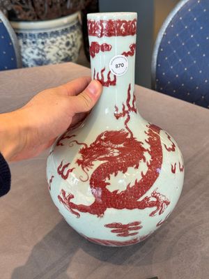 A Chinese copper-red and white 'dragon' bottle vase, 18th C. — photo 1