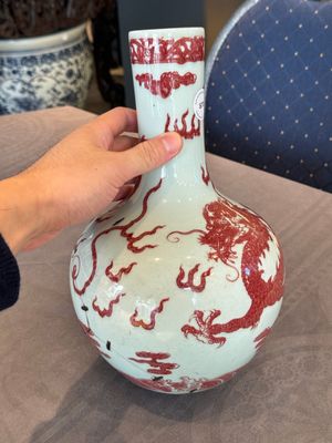 A Chinese copper-red and white 'dragon' bottle vase, 18th C. — photo 2