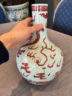 A Chinese copper-red and white 'dragon' bottle vase, 18th C. — photo 3