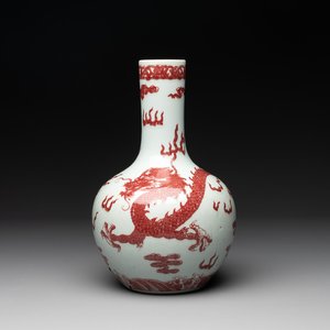 A Chinese copper-red and white 'dragon' bottle vase, 18th C. — photo 1