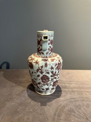 A Chinese copper-red and white 'flower scroll' ewer, Ming or later — photo 4