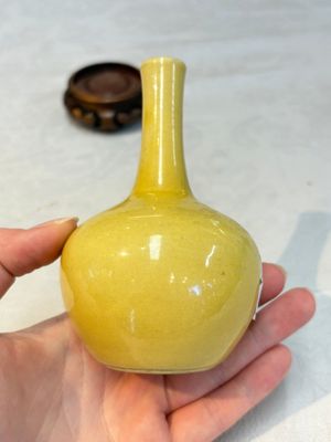 A Chinese copper-red and white 'Mythical Beasts' vase and a yellow-glazed bottle vase, on later wooden stands, Kangxi and later — photo 5