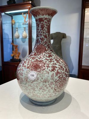 A Chinese copper-red bottle vase with floral scrolls, Qianlong — photo 3