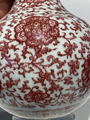 A Chinese copper-red bottle vase with floral scrolls, Qianlong — photo 10