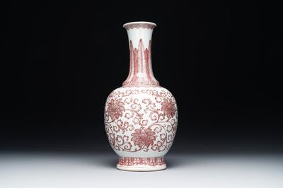 A Chinese copper-red-decorated 'lotus scroll' bottle vase, Qianlong