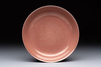 A Chinese copper-red-glazed incised 'dragon' plate, Guangxu mark and possibly of the period