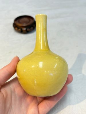 A Chinese copper-red 'mythical beasts' vase and a yellow-glazed bottle vase, with two wooden stands, Kangxi and later — photo 4