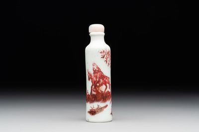 A Chinese copper-red snuff bottle with travellers in a landscape, Qianlong mark, 19th C.