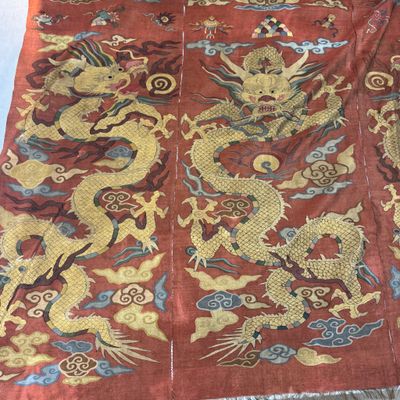 A Chinese coral-ground kesi 'Dragons' panel — photo 1