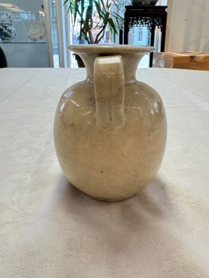 A Chinese cream-glazed ewer with a barrel-shaped body, Hebei/Henan provinces, Tang/Five Dynasties — photo 2