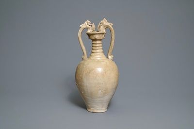 A Chinese cream-glazed stoneware amphora with dragon handles, Sui/Tang