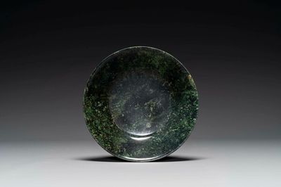 A Chinese dark green jade bowl, 18th C.