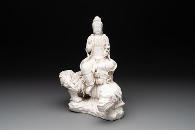 A Chinese Dehua blanc de Chine Bodhisattva seated on a Buddhist lion, 20th C.