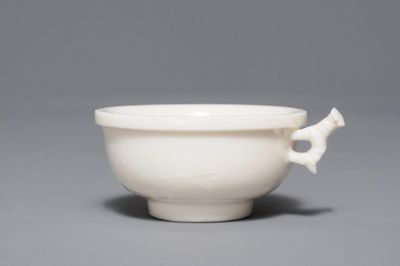 A Chinese Dehua blanc de Chine cup with applied design, Kangxi