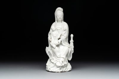 A Chinese Dehua blanc de Chine figure of Guanyin with a boy, Kangxi/Qianlong