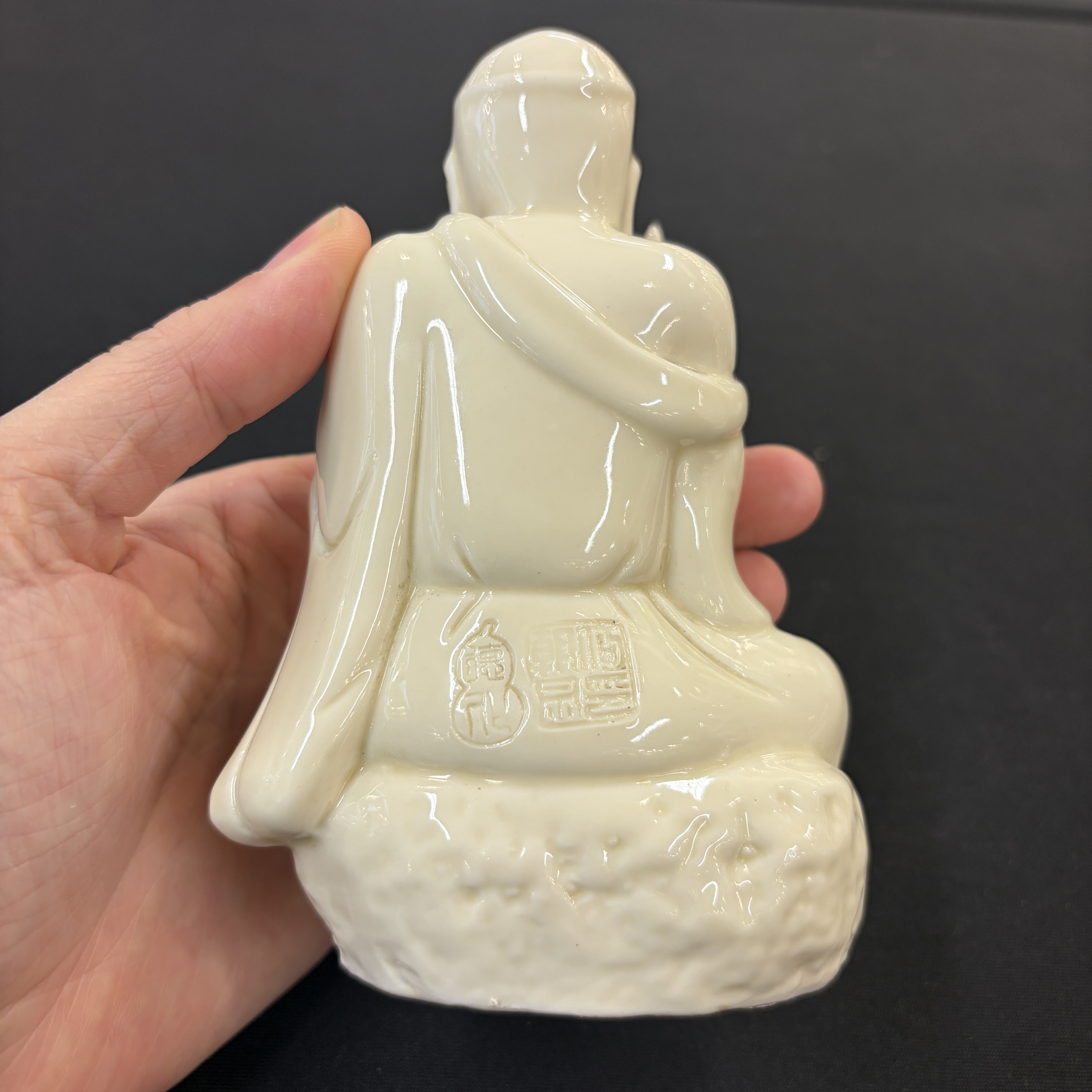 A Chinese Dehua blanc de Chine figure of Luohan and three monochrome wares, one with a wooden stand — photo 3