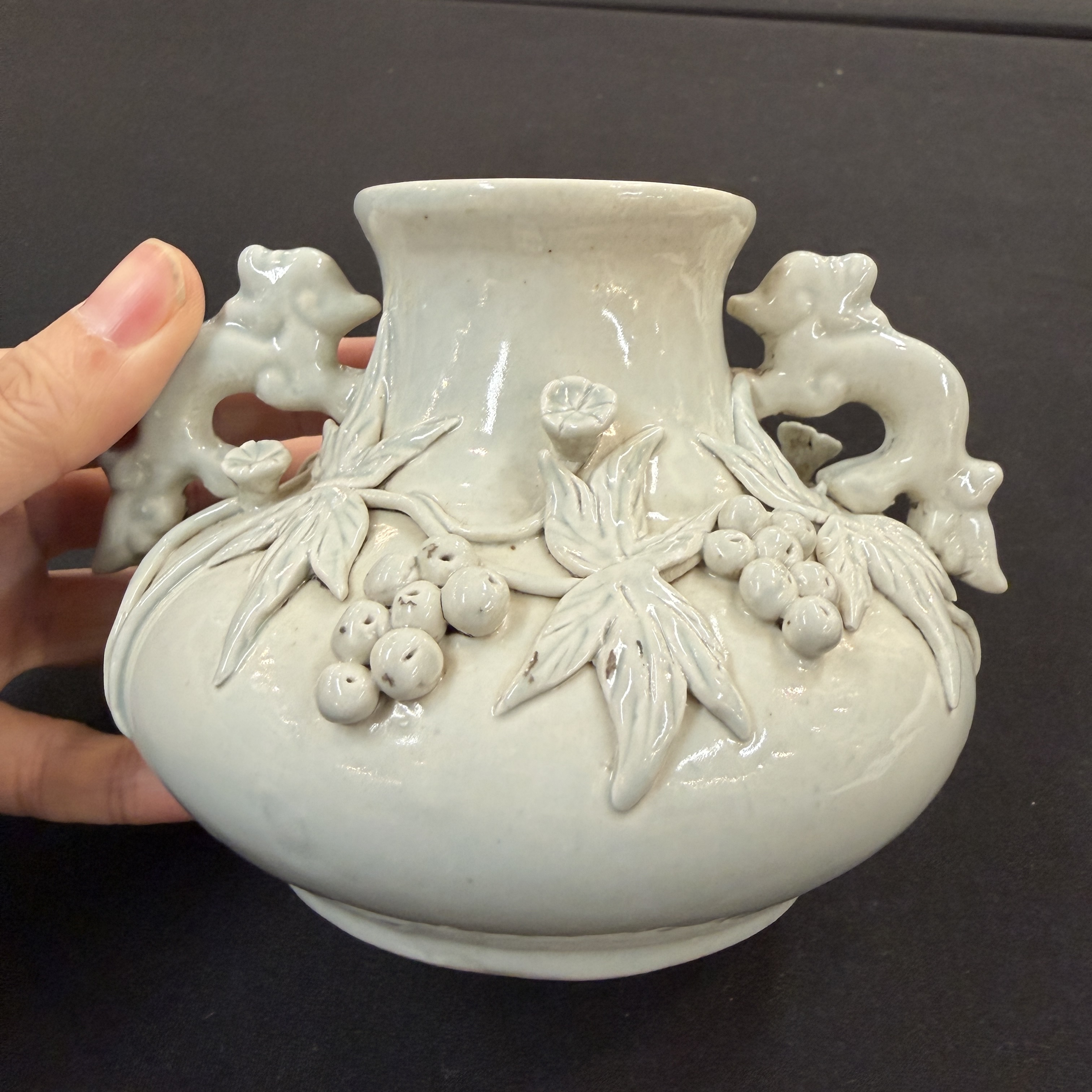 A Chinese Dehua blanc de Chine figure of Luohan and three monochrome wares, one with a wooden stand — photo 24