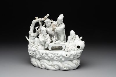 A Chinese Dehua blanc de Chine group of four deities on a boat, Republic