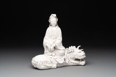 A Chinese Dehua blanc de Chine Guanyin seated on a Buddhist lion, 20th C.