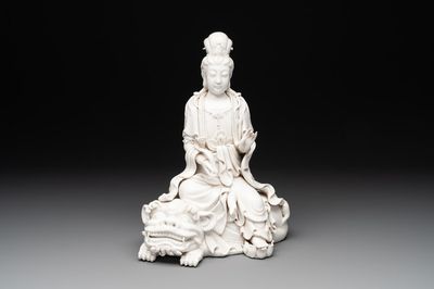 A Chinese Dehua blanc de Chine Guanyin seated on a lion, 20th C.