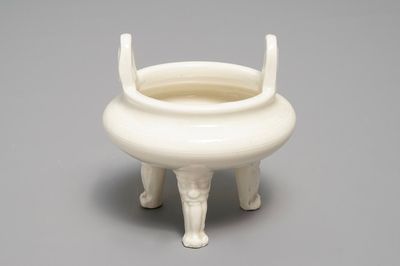 A Chinese Dehua blanc de Chine tripod censer, impressed seal mark, Kangxi