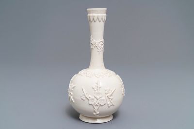 A Chinese Dehua blanc de Chine vase with applied floral designs, Kangxi