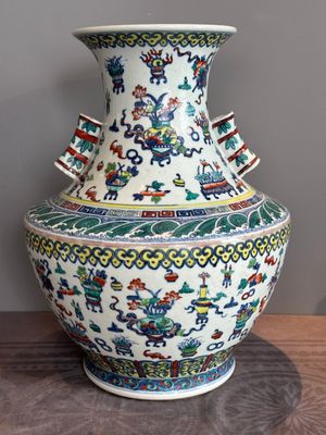 A Chinese doucai 'antiquities' 'hu' vase, Qianlong mark, 19th C. — photo 3