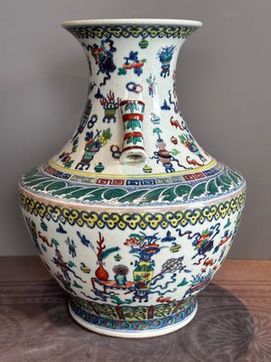 A Chinese doucai 'antiquities' 'hu' vase, Qianlong mark, 19th C. — photo 4
