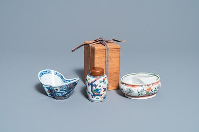 A Chinese doucai bowl, a famille verte spice box and a wucai tea caddy, Kangxi and later